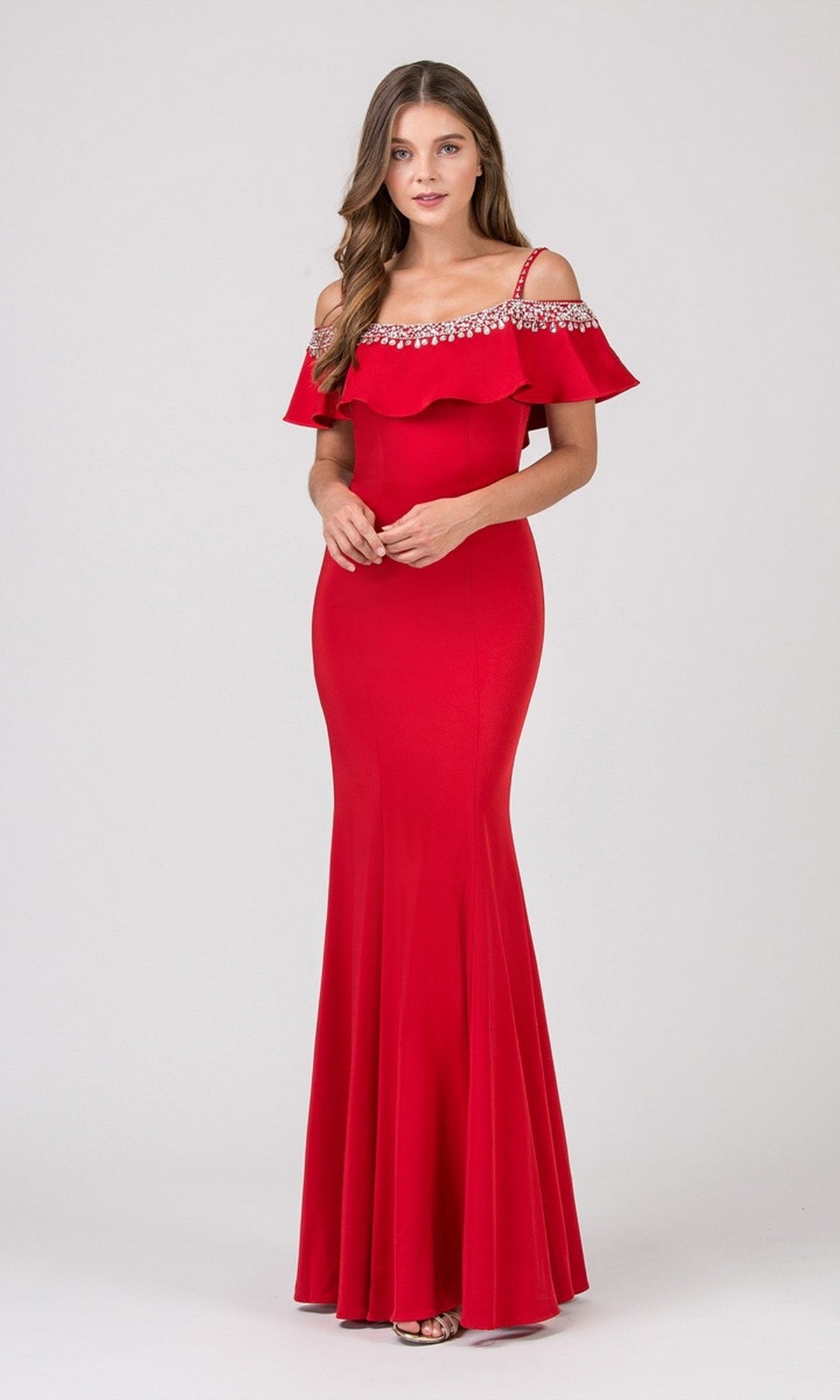 A woman models the Eureka 7333 long red prom dress, featuring a fitted off-the-shoulder design with ruffle and jeweled details, against a plain light background.